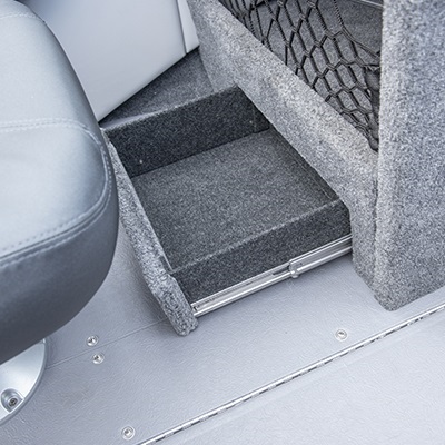 Tiroir de rangement sous la console passager